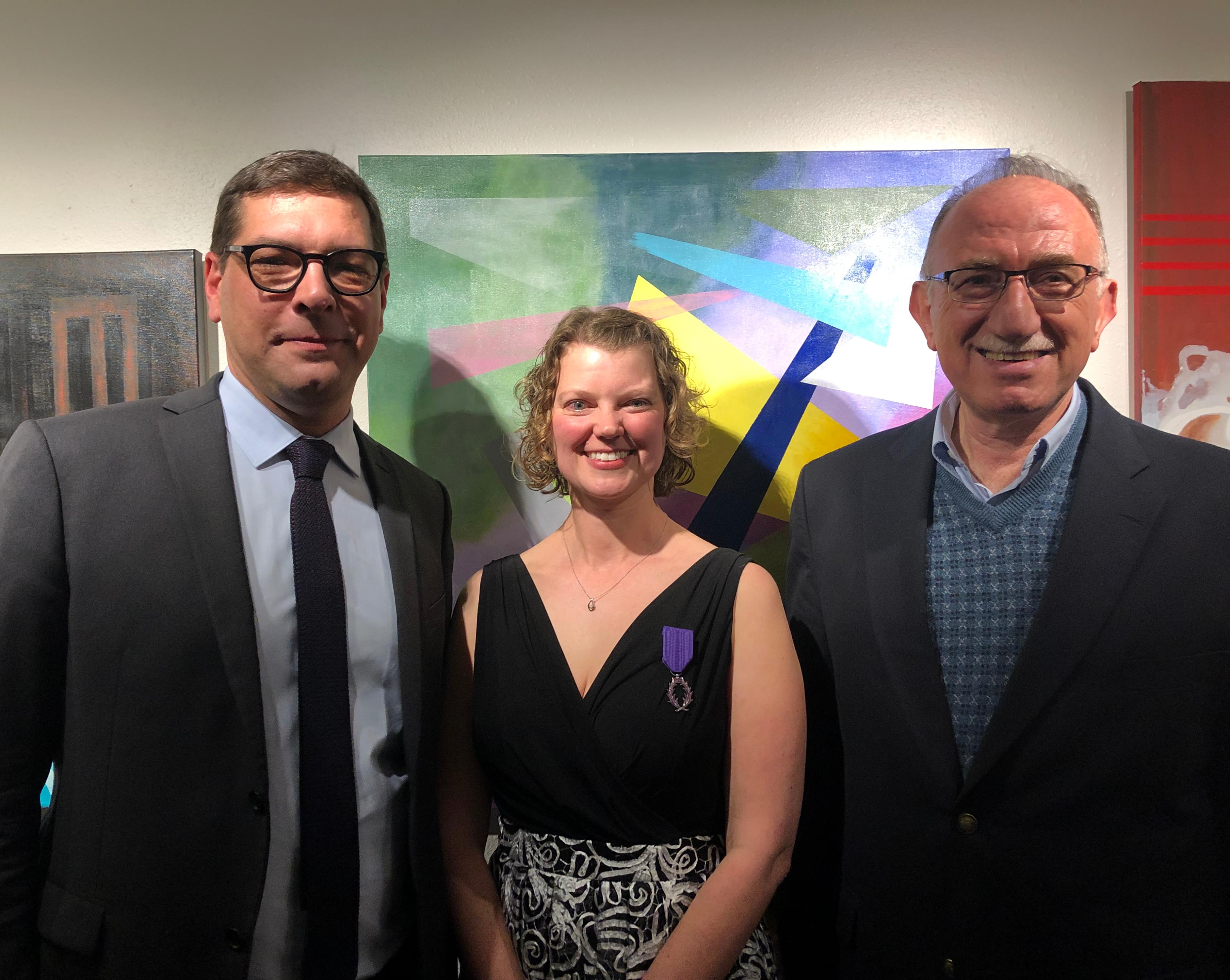 Megan Diercks, center, with the French Consul General and HASS Director Hussein Amery